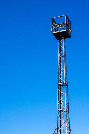 metal tower with lights industry object in the blue sky verticalの写真素材