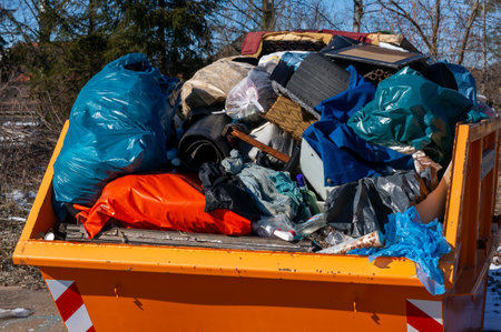 orange container with garbage waste separation at the recycling center