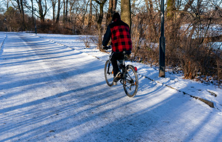 cyclist in the snow, danger of fallingの写真素材