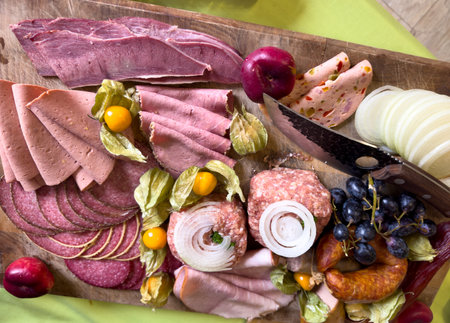 Sausage platter with different types of sausage on a wooden board