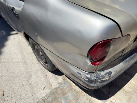 Paint damage scratches on a silver carの写真素材
