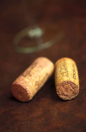 two wine corks and leg of a glassの写真素材