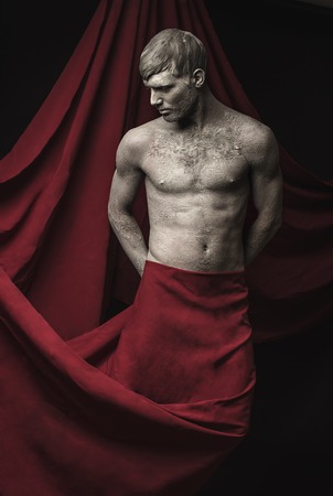 Portrait of Athletic Young Men with Skin Covered in Mud.の写真素材