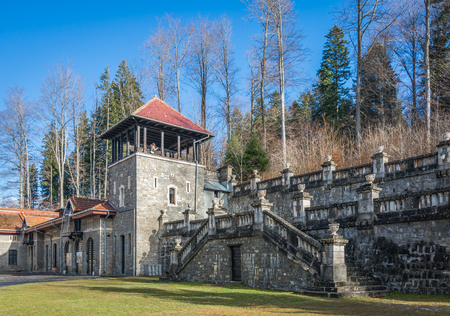 Cantacuzino Castle and the Carpathian Mountains in a sunny day. Residence and museum in a Transylvanian Busteni city, Romaniaのeditorial素材