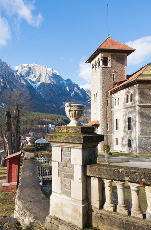 Cantacuzino Castle and the Carpathian Mountains in a sunny day. Residence and museum in a Transylvanian Busteni city, Romaniaの写真素材