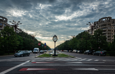 BUCHAREST, ROMANIA - 07.20.2018. Clock Bucharest 1459 on Union Boulevard in Romania in a summer morningのeditorial素材
