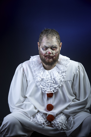 Portrait of a Scary Evil Clown.  Studio shot with horrible face artの写真素材