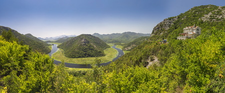 Panoramic view from above of the huge bend of Tsrnoyevicha river and the forest around, Rijeka Crnojevica in Montenegroのeditorial素材