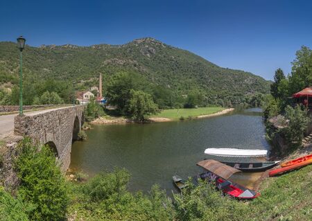 Skadar lake, Montenegro - 07.15.2018.  Panoramic view of the New Bridge over Crnojevica river, Rijeka Crnojevica, and the tourist area near the bridge, Rijeka Crnojevica.のeditorial素材
