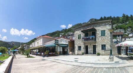 Skadar lake, Montenegro - 07.15.2018.  Panoramic view of the Old Bridge over Crnojevica river, Rijeka Crnojevica, and the tourist area near the bridge, Rijeka Crnojevica.のeditorial素材