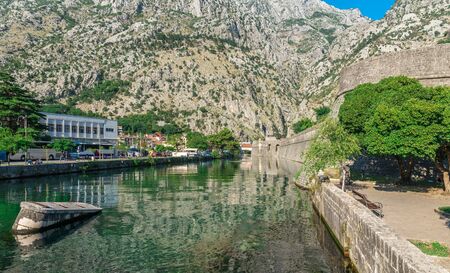 Kotor, Montenegro - 07.11.2018. Massive walls of the fortification Bastion Riva by the river Shkurda in Kotor Old Town in a sunny summer dayのeditorial素材