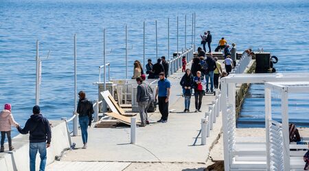 Odessa, Ukraine - 04.22.2019. Beach and pier in Arcadia resort in Odessa, Ukraine on a sunny spring...