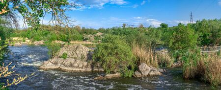 Southern Bug river in Mygiya village, Ukraine, on a sunny summer day