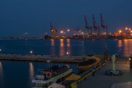 Panoramic view of the sea port and cargo terminal in Odessa, Ukraine, at the summer night