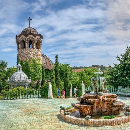 Ravadinovo, Bulgaria â 07.11.2019.  Fountain in the square near the church on the territory of the Ravadinovo castle in Bulgaria, on a sunny summer dayのeditorial素材