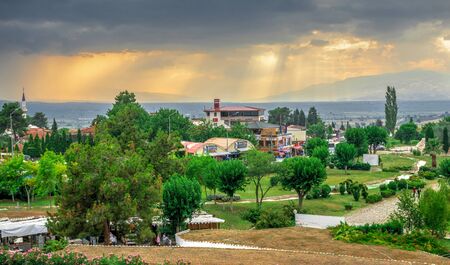 Pamukkale, Turkey â 07.14.2019. Panoramic view of Pamukkale village on a cloudy summer evening.のeditorial素材