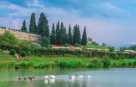 Pamukkale, Turkey â 07.14.2019. Green lake in Pamukkale on a cloudy summer evening.のeditorial素材