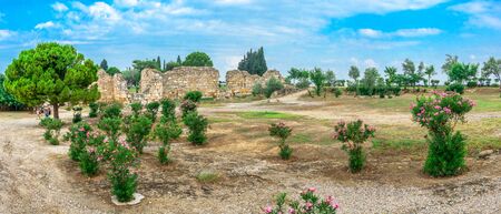 Walls of the Hierapolis ancient city in Pamukkale, Turkey, on top of the white Pamukkale mountain on a summer morning.の写真素材