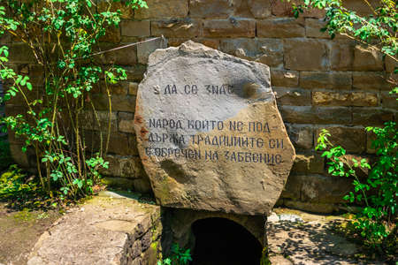 Memorial stone in the Etar Architectural Ethnographic Complex in Bulgaria on a sunny summer dayのeditorial素材
