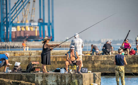 Odessa, Ukraine 09.03.2019. Fishermen on the Langeron beach in Odessa, Ukraine, on a sunny summer dayのeditorial素材