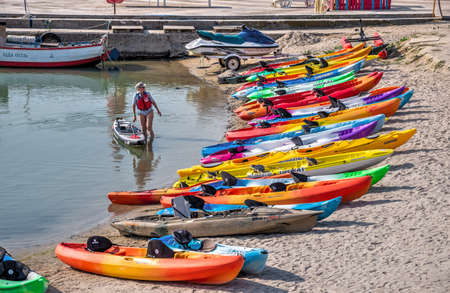 Odessa, Ukraine 09.03.2019. Multi-colored kayaks on the Langeron Beach in Odessa, Ukraine, on a sunny summer dayのeditorial素材