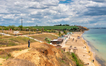 Yuzhne, Ukraine 05.23.2020. Seaside park and Public beach in the city of Yuzhne, Ukraine. Panoramic view on a sunny spring dayのeditorial素材