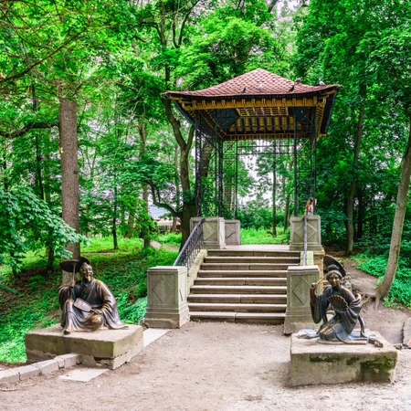 Bila Tserkva, Ukraine 06.20.2020. Chinese bridge in the Alexandria park, one of the most beautiful and famous arboretums in Ukraine, on a cloudy summer day.のeditorial素材
