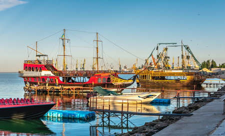 Berdyansk, Ukraine 07.23.2020. Pleasure boats on the embankment of the Azov Sea in Berdyansk, Ukraine, in an early summer morningのeditorial素材