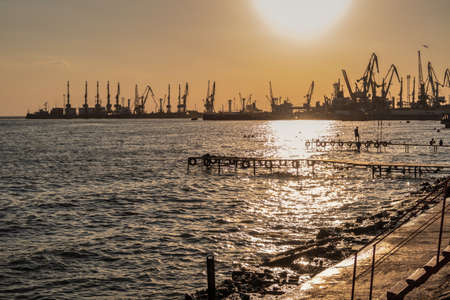 Berdyansk, Ukraine 07.24.2020. Public beach in Berdyansk, Ukraine, on a sunny summer eveningのeditorial素材