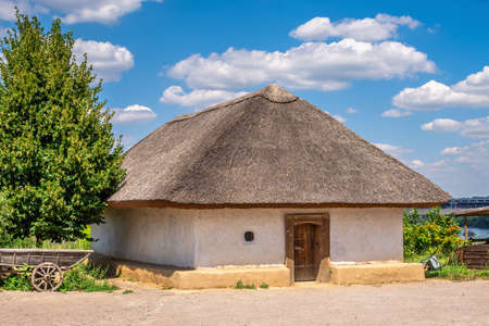 Zaporozhye, Ukraine 07.20.2020. Traditional Ukrainian hut in the National Reserve Khortytsia in Zaporozhye, Ukraine, on a sunny summer dayのeditorial素材