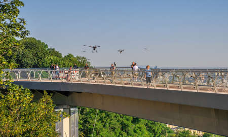 Kyiv, Ukraine 07.11. Pedestrian glass bridge in Kyiv, Ukraine, on a sunny summer morningのeditorial素材