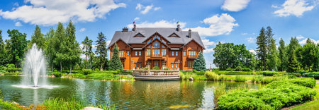 Kyiv, Ukraine 07.10. Honka or the main wooden house in the Mezhyhirya Residence, Kyiv, Ukraine, on a sunny summer dayのeditorial素材