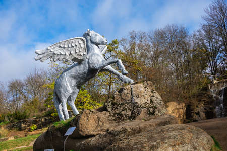 Uman, Ukraine 07.11. Park sculpture in the Sofievsky arboretum or Sofiyivsky Park on a sunny autumn dayのeditorial素材