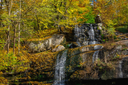 Valley of the Giants and waterfall in the Sofievsky arboretum or Sofiyivsky Park in Uman, Ukraine, on a sunny autumn dayの写真素材