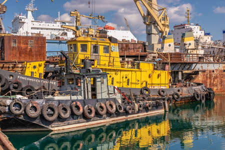 Chernomorsk, Ukraine. 03/21/2021. Tugboats in the Chernomorsk Shipyard on a sunny spring day
