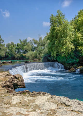 Manavgat waterfall and river in Antalya province of Turkey on a sunny summer dayの写真素材