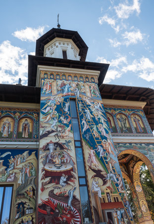 Neamt Monastery, Romania â October 15.2025. The distinctive painted facade of the Church of Saint Ioan Jacob, Sf. Ioan Iacob Hozevitul, at Neamt Monastery, a vital and ancient Orthodox center in Moldavia, Romaniaのeditorial素材