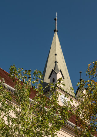Targu Mures, Romania - October 17. 2025. The historic Reformed Church within the Targu Mures Fortress walls, featuring medieval brick and white plaster under a clear blue skyのeditorial素材