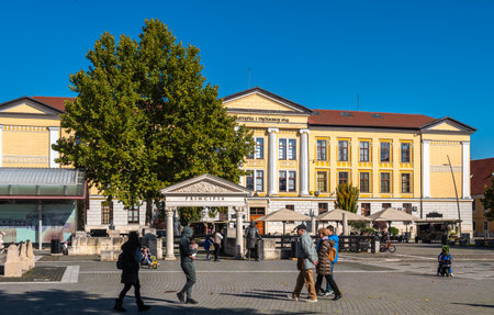 Alba Iulia, Romania - October 19.2025. The main building of the univercity overlooking a bustling public square within the Alba Carolina Citadelのeditorial素材