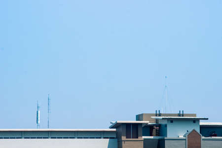 Rooftop of building and clear blue skyの写真素材