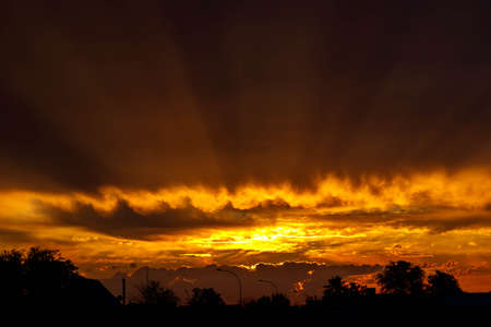Dramatic, burning, colorful African Sunset Skyの写真素材