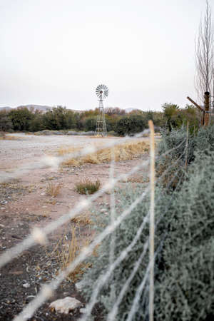 Old windmill in the middle of the desert.の写真素材