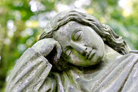 Weathered statue of an Angel - tombstone - old Prague cemetery, Czech republic, Europeの写真素材