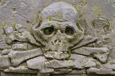 Carved skull with crossbones on the Tombstone - old Prague cemetery, Czech republic, Europeの写真素材