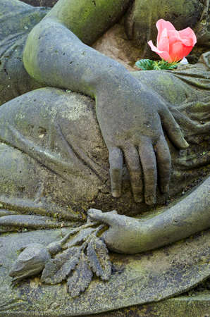 Mourning statue of Mother and child - detail - old cemetery at Krasna Lipa, Czech republic, Europeの写真素材