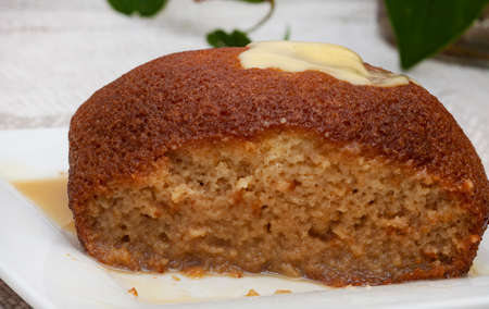 Traditional South African Dessert, Malva pudding. served hot with custardの写真素材