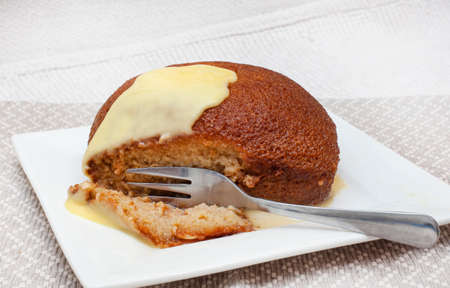 Traditional South African Dessert, Malva pudding. served hot with custardの写真素材