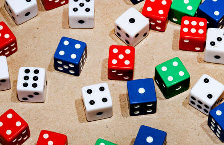 Selection of colored playing dice with copy spaceの写真素材