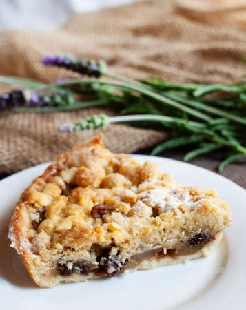 slice of Apple crumble pie with rustic background and rough textures