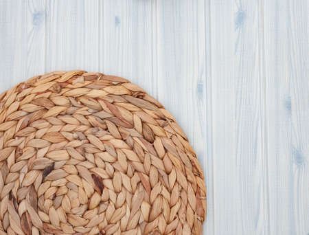 Beach feel flat lay on blue wood grain with fabric and copy space